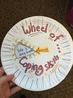 a paper plate with the words wheel of going ski written on it