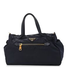 This is an authentic PRADA Tessuto Nylon Saffiano Tote in Navy.This stylish shoulder bag is crafted of blue nylon. The bag features looping leather handles, a triangle Prada logo on the front, and a top zipper that opens to a blue jacquard fabric interior with zipper and patch pockets. Designer Nylon Shoulder Bag With Detachable Handle, Luxury Nylon Bag With Detachable Handle, Designer Nylon Top Handle Bag, Designer Nylon Bag With Double Handle, Designer Nylon Bags With Double Handle, Luxury Nylon Shopping Bag, Designer Nylon Shoulder Bag With Top Carry Handle, Luxury Nylon Shoulder Bag With Top Handle, Luxury Nylon Tote Bag