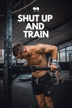 a man doing pull ups with the words shut up and train above him