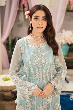 Pakistani Wedding Kameez Lehenga Dress in Net has an alluring powder blue shade that gives a ravishing appearance to the attire. Stunning embroidery work and crystals give a traditional and royal appearance to this elegant masterpiece making it your foremost priority for the day. Kameez: Beautiful kameez in the premium quality net fabric is emblazoned with embroidery work. Glamorous embellishments of crystals and cut dana enhance the overall charm of this Kameez. Classic designs and fine details Blue Pakistani Dress, Kameez Lehenga, Lehenga Dress, Organza Lehenga, Organza Shirt, Pakistani Wedding Dress, Blue Lehenga, Photoshoot Concept, Skirt And Blouse