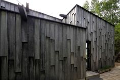 the exterior of a building made out of wooden planks