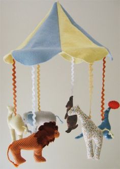 a mobile with animals hanging from it's sides