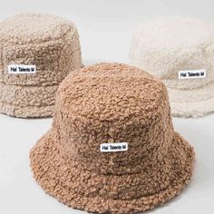 three different types of hats with labels on them