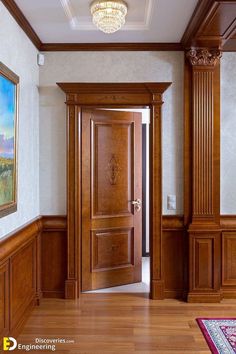 an empty room with wood paneling and a painting on the wall