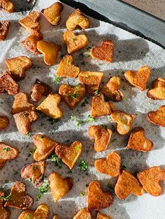 some heart shaped pieces of bread sitting on top of a paper towel