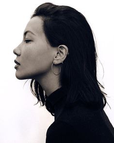 a black and white photo of a woman's profile with her eyes closed to the side