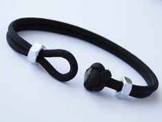 two black and white ropes with silver clasps