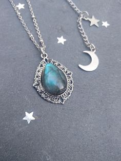 PLEASE read my shop announcement before placing an order so you know what to expect right now. Plus, when ordering from outside Europe, don't forget to provide a phone number for the courier to ensure the fastest and smoothest delivery. Simple celestial labradorite necklace in antique silver color / stainless steel chain, AAA quality gemstone, with a stunning flashy dark blue shine, perfect pendant necklace for any magical boho outfit to layer with other necklaces and chokers. I wanted a very sh Mystical Teardrop Necklace For Gift, Mystical Silver Teardrop Necklace, Celestial Silver Labradorite Necklace, Celestial Style Labradorite Necklace For Gifting, Celestial Labradorite Necklace For Gifting, Celestial Style Labradorite Necklace For Gift, Celestial Labradorite Necklace Gift, Celestial Labradorite Necklace For Gift, Silver Teardrop Necklaces With Moon Charm