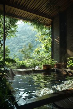 an outdoor swimming pool surrounded by lush green trees and bushes, with water flowing from the ceiling