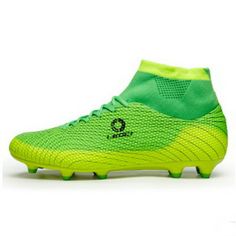 a green soccer shoe with the word on it's side and an image of a black