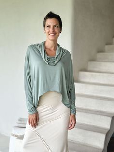 Dolman Cowl Top The Dolman Cowl Top is our best-selling top. It is soft, loose, lightweight, and has an effortless oversized feel with extra-long dolman sleeves and thumb holes. We love layering this relaxed-fit top over our slim-fit tanks, tees, and dresses. One Size (O/S) Colors This long sleeve jersey top is available in these colors: Copper Steel Plum Black Canal Blue Jam Jasper Navy Scarlet Teal White Wine Moss Cream Learn MoreWant to learn more about our plant-based fabrics made in small b Relaxed Solid Color Tops For Fall, Relaxed Fall Tops, Solid Color Relaxed Tops For Fall, Long Sleeve Lagenlook Top, Versatile Spring Tops With Thumbholes, Oversized Top For Layering In Fall, Versatile Long Sleeve Top With Thumbholes For Spring, Stretch Solid Color Cowl Neck Top, Relaxed Stretch Tops For Layering