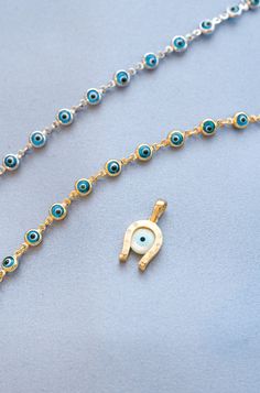 Kalypso Evil Eye Bracelet - Small — Hellenic Aesthetic Yellow Gold Charms Bracelet For Good Luck, Yellow Gold Good Luck Charms Bracelets, Good Luck Charms Bracelet, Gold Symbolic Bracelet With Evil Eye, Symbolic Gold Bracelets With Evil Eye, Gold Spiritual Evil Eye Bracelet With Adjustable Chain, Spiritual Gold Bracelets With Evil Eye, Yellow Gold Evil Eye Jewelry For Good Luck, Gold Evil Eye Bracelet With Charms As Gift