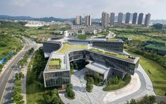 an aerial view of a building with green roof