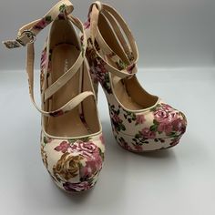 Very Cute, Very High Heel, Flowery, Strappy Pump. Beautiful Off White Fabric With Flowers Covers The Entire Shoe. Cross Straps Join Into Ankle Strap. 5.75” Heel, With 1.5” Platform Shoes Are Brand New. P-106 White Heels Pink Flowers, Spring Floral Print High Heels, Floral Print Flower Heels For Spring, Spring Heels With Floral Print And Ankle Strap, Chic Floral Print Heels With Round Toe, Floral Print Heels For Spring, Fitted Floral Print Heels For Spring, Casual Floral Print Heels For Spring, Chic Closed Toe Floral Print Heels