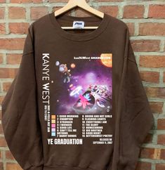 Kanye SweatShirt, Late Registration sweatshirt, West Tour 2023 tshirt, Kanye Graphic tshirt, gift for men women Comfort Color ABOUT MATERIAL: Comfort Colors® 1717 Made with medium fabric (6.1 oz/yd² (206.8 g/m consiting of high quality, 100% ring-spun US cotton for long-lasting comfort. The relaxed fit keeps the wearer comfy in both casual and semi-formal settings while the crew neckline delivers that classic, neat style which makes it perfect for accessorizing. What's more, the pre-shrunk fabri Cotton Band Merch Short Sleeve Sweatshirt, Cotton Short Sleeve Sweatshirt Band Merch, Cotton Sweatshirt With Custom Print For Streetwear, Band Merch Crew T-shirt For Winter, Winter Graphic Print Short Sleeve Sweatshirt, Streetwear Custom Print Crew Top, Winter Band Merch Crew T-shirt, Winter Band Merch T-shirt With Crew Neck, Custom Print T-shirt For Fall Streetwear