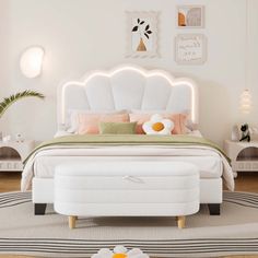 a white bed sitting on top of a wooden floor