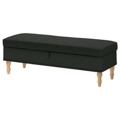 the footstool is made from wood and has a dark green upholstered fabric