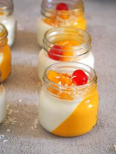 small jars filled with different types of desserts