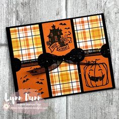 an orange and black halloween card with pumpkins, bats and a castle on it