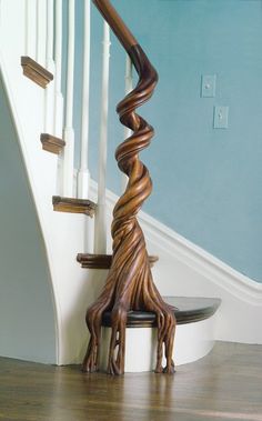 a spiral staircase in a house with blue walls