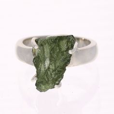 SpecificationsItem Code: SR996Size US: 8Weight: 35 Carats (7 grams) Unique Qualities Expertly made with authentic Czech moldavite, this exquisite ring is crafted from premium sterling silver. Featuring a one-of-a-kind size 8 design, this ring is a must-have addition to any jewelry collection. Elevate your style with a touch of refinement and grace with this remarkable moldavite ring. Moldavite Ring, Moldavite Jewelry, Moldavite Stone, Gemstone Properties, Rare Stone, Authentic Design, Elegant Ring, Size 10 Rings, Multi Stone Ring