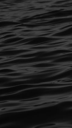 black and white photograph of water with ripples