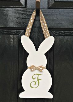 an easter bunny door hanger with polka dots and a monogrammed letter f