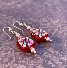 Floral Painted Art Glass Earrings With Swarovski Pearls, Czech Pressed Glass, and Sterling Silver - Etsy Handmade Pink Czech Glass Jewelry, Adjustable Hand Painted Red Jewelry, Adjustable Hand-painted Red Jewelry, Adjustable Red Hand-painted Jewelry, Adjustable Red Hand Painted Jewelry, Handmade Pink Glass Jewelry, Elegant Red Hand Painted Jewelry, Beaded Czech Glass Flower Earrings Gift, Pink Flower Glass Jewelry