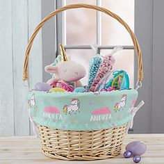 a basket filled with toys on top of a wooden table