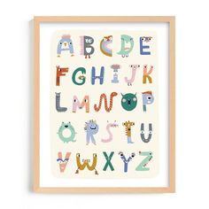 a framed poster with an animal alphabet