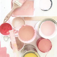 some pink paint is sitting on a table