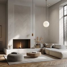 a modern living room with wood floors and white walls, an open fire place in the fireplace