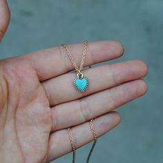 This solid 14K gold necklace features a Kingman turquoise heart stone set in a thick serrated bezel. The back of the pendant is stamped with my maker's mark and 14K quality stamp. The pendant hangs from an 18 inch long 1.5mm oval cable style chain. ★ All orders come wrapped in a gift box, ready for gifting ★ Turquoise Jewelry With Heart Charm, Turquoise Pendant Necklace With Heart Charm, Turquoise Heart Charm Jewelry, Turquoise Heart Pendant Necklace, Turquoise Heart Charm Pendant Jewelry, Turquoise Heart Charm Pendant Necklace, Turquoise Heart Cut Jewelry With Heart Charm, Turquoise Heart Pendant Necklace With Gemstone, Handmade Heart-shaped Turquoise Necklace