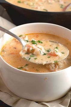 a bowl of soup with a spoon in it