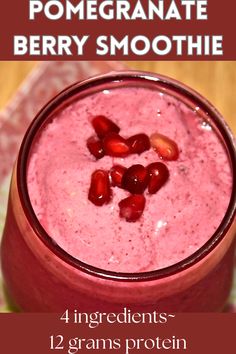 a smoothie with pomegranate and berries on top is shown in this recipe