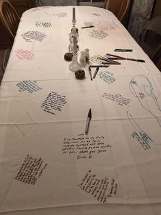 a long table with writing on it and some pens sitting on top of the table