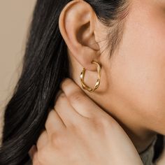 Our Ripple Hoop Earrings are inspired by the ripple effect that a pebble can cause in the ocean - these hoops stand as a reminder that you can have a ripple effect on the world with even the smallest action. Materials & Warranty Material: Real 18 karat gold plating on pure stainless steel Hypoallergenic | Sensitive Skin-Friendly Warranty: Lifetime Warranty against all rust or tarnish Packaging: Nominal Velvet Drawstring Pouch Earrings cannot be returned or exchanged due to hygienic safety The Ripple Effect, Ripple Effect, Drawstring Pouch, In The Ocean, Silver Hoop Earrings, Gold Plating, The Ocean, Sensitive Skin, Rust