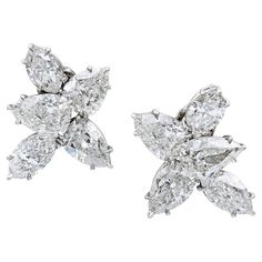 Introducing a stunning pair of diamond cluster earrings that are sure to captivate anyone's attention. These earrings feature a dazzling combination of marquise and pear-shaped diamonds that create a truly breathtaking effect. The earrings boast a total carat weight of 9.22 carats, with 4 marquise diamonds weighing 3.39 carats and 6 pear-shaped diamonds weighing 5.83 carats. While these diamonds are not certified, they are estimated to have a G-H color and VS-SI clarity, ensuring their exception Harry Winston Earrings, Harry Winston Diamond, Van Cleef & Arpels, Diamond Cluster Earrings, Platinum Earrings, Pear Cut Diamond, Harry Winston, Earrings Clip, Solitaire Diamond