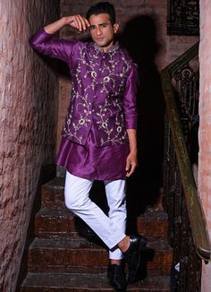 Features a purple silk bundi jacket embroidered with silver work teamed with a raw silk Kurta and white cotton chinos Buy the matching set for your partner here. Composition: Kurta and Bundi - Silk , Chinos - Cotton All products can be customised for sleeves, length of blouse and neck design Delivery : 4-6 weeks as the product is hand crafted. Check Size Guide or choose MySize for free customisation (All Sizes above XL can be made at 15% additional cost) For more information and sizes please con Purple Colour Outfit, Raw Silk Kurta, Purple And Silver, Gold Blouse, Silk Kurta, Sequence Work, Work Skirts, Cotton Chinos, Purple Silk