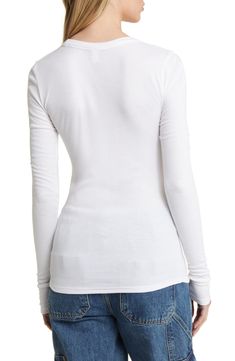 A stretchy rib knit perfects the figure-hugging fit of this lithe, long-sleeve T-shirt. 25 1/2" length (size Medium)   Crewneck   Long sleeves   97% Lenzing™ EcoVero™ viscose, 3% spandex   Lenzing EcoVero viscose is a sustainably produced fiber using pulp made from renewable wood sources and certified with the EU Ecolabel for high environmental standards, including lower emissions and water usage than generic viscose   Hand wash, dry flat   Imported   Not available for sale and shipment to Germa Fitted Ribbed Long Sleeve T-shirt, Fitted Long Sleeve Ribbed T-shirt, High Stretch Ribbed Long Sleeve Tops, White Fitted Long Sleeve Top For Fall, White Stretch Long Sleeve Top For Fall, Fitted White Ribbed Long Sleeve Top, Fitted White Long Sleeve Ribbed Top, White Fitted Top For Winter, White Long Sleeve Stretch Top With Thumbholes