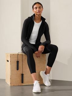 FOR: Medium to high-impact workouts at the gym, studio, or outdoors FEEL: PowerMove fabric is engineered with interlock construction using 50-gauge knitting technology, offering sleek, compressive support and a no-slip fit FAVE: Removable hood Thumbholes hold sleeves in place and keep warmth in Secure zip pockets to store your essentials Fitted next to the body High hip length, hem hits at upper hips Body length in size medium: Regular: 24" Petite: Front 24" Back 22" Tall: 25". Technical Nylon Track Jacket For Gym, High Stretch Nylon Sports Outerwear, High Stretch Nylon Outerwear For Athleisure, High Stretch Nylon Outerwear For Sports, Sports Nylon Outerwear With High Stretch, Functional High Stretch Nylon Outerwear, Nylon Track Jacket For Gym, Compressive Athleisure Activewear For Light Sports, Fitted Black Activewear In Technical Fabric