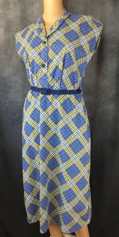 Shirtwaist Sleeveless Blue & Yellow Plaid Vintage Dress  Sleevless Dresss Includes matching blue belt *Note: Belt is stiff and crinkly* No tags Fits Size Samll/Medium Feels like Cotton  Vintage Era 1950-60's  Preowned-Excellent condition Blue Belted Dress For Daywear, Sleeveless Summer Dress With Sashes, Blue Fitted Sleeveless Dress For Daywear, Sleeveless Belted Day Dress, Fitted Sleeveless Retro Plaid Dress, Vintage Sleeveless Plaid Summer Dress, 1950s Plaid Summer Dresses, Retro Cotton Plaid Dress, Vintage Sleeveless Plaid Cotton Dress