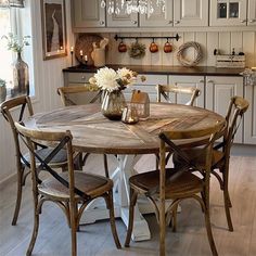 a dining room table with chairs around it