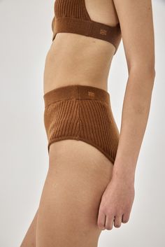 The coziest panties you'll own. Perfect for lounging around. High waisted. High leg opening. Ribbed material. Elastic waistband. Mini embroidered logo detailing on the back waistband. Pair it with the cozy bralette and cardigan and get ready to feel like you are in a cloud. 50% Acrylic 27% Polyester 23% Nylon Color: Ginger Brown Care: Hand wash only in cold lukewarm water. Do not bleach. Do not tumble dry. Do not wring. Dry flat. Dry clean, any solvent except Trichloroethylene. True to size. Mod Ginger Brown, Earth Angel, Sweaters Knitwear, High Leg, S Models, Skirt Pants, Casual Look, Shirt Jacket, Denim Dress