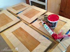 the table is being prepared to be painted with some paint and wood planks on it