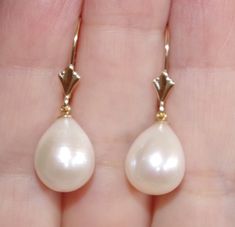 Quality japan 14k golden white 27mm tear drop cultured pearl leverback earrings being offered is a fabulous 14k 27mm large golden / white japan cultured pearls perfect tear drop white / golden pearl earrings these earrings are new old stock pearls they are from japan , quality lustorous , well matched japanese pearls are famous for being top rated quality they are new old stocks i have few pairs. plesae see photos. photos rae just the sample. let me know if you need to see a photo of what i have Cheap Teardrop Earrings With Pearl Charm, Classic White Pear-shaped Teardrop Earrings, White Teardrop Earrings For Formal Occasions, Classic White Teardrop Earrings For Formal Occasions, White Teardrop 14k Gold Earrings, White 14k Gold Teardrop Earrings, Elegant White Jewelry With Lever Back, Classic Teardrop Lever Back Jewelry, White Drop Teardrop Earrings For Formal Occasions