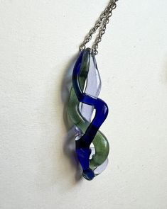 Green, blue, and purple braided glass pendant. I created this form by melting and braiding straight glass rods. Chain is optional. Handmade from borosilicate glass. Purple Braids, Jewelry Inspo, Glass Jewelry, Glass Pendant, Glass Pendants, Pendant Necklaces, Blue And Purple, Jewelry Necklace Pendant, Violet