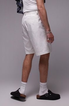 Made from pure cotton and styled with crisp pleats, these shorts are ideal for casual warm-weather days. Zip fly with hook-and-bar tab closure Side-seam pockets; back welt pockets 100% cotton Machine wash, line dry Imported Cotton Bermuda Shorts With Pockets, Cotton Cargo Shorts For Summer, Cotton Cargo Shorts With Pockets For Summer, Classic White Bottoms For Summer, Classic Spring Shorts With Belt Loops, Classic White Summer Bottoms, Classic White Bermuda Shorts For Summer, Classic Fitted Shorts With Side Pockets, Cotton Bermuda Shorts With Welt Pockets