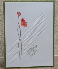 a greeting card with two red flowers on it