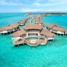 an aerial view of a resort in the ocean